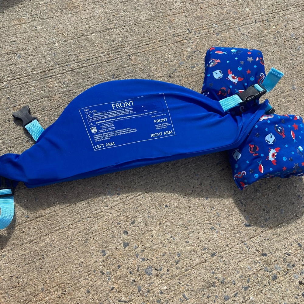Life safety vest with detachable shimmies